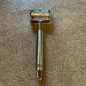 Kuhn Rikon Stainless Steel julienne stle callable peeler. Swiss quality